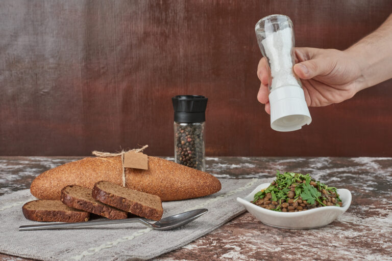 Adding salt into lentil salad